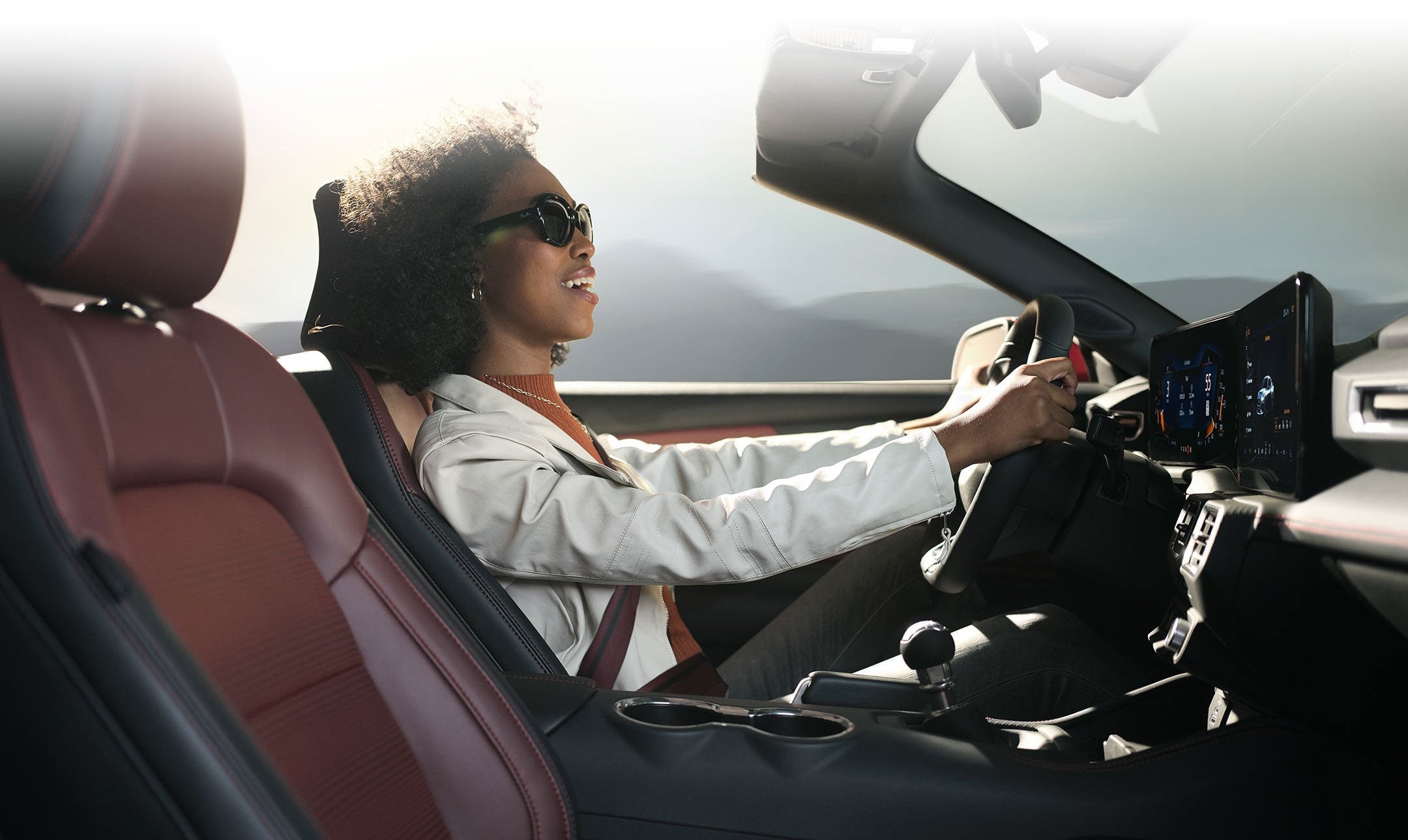 Person sitting in the driver’s seat of a 2024 Ford Mustang® convertible | Bergstrom Ford of Neenah in Neenah WI