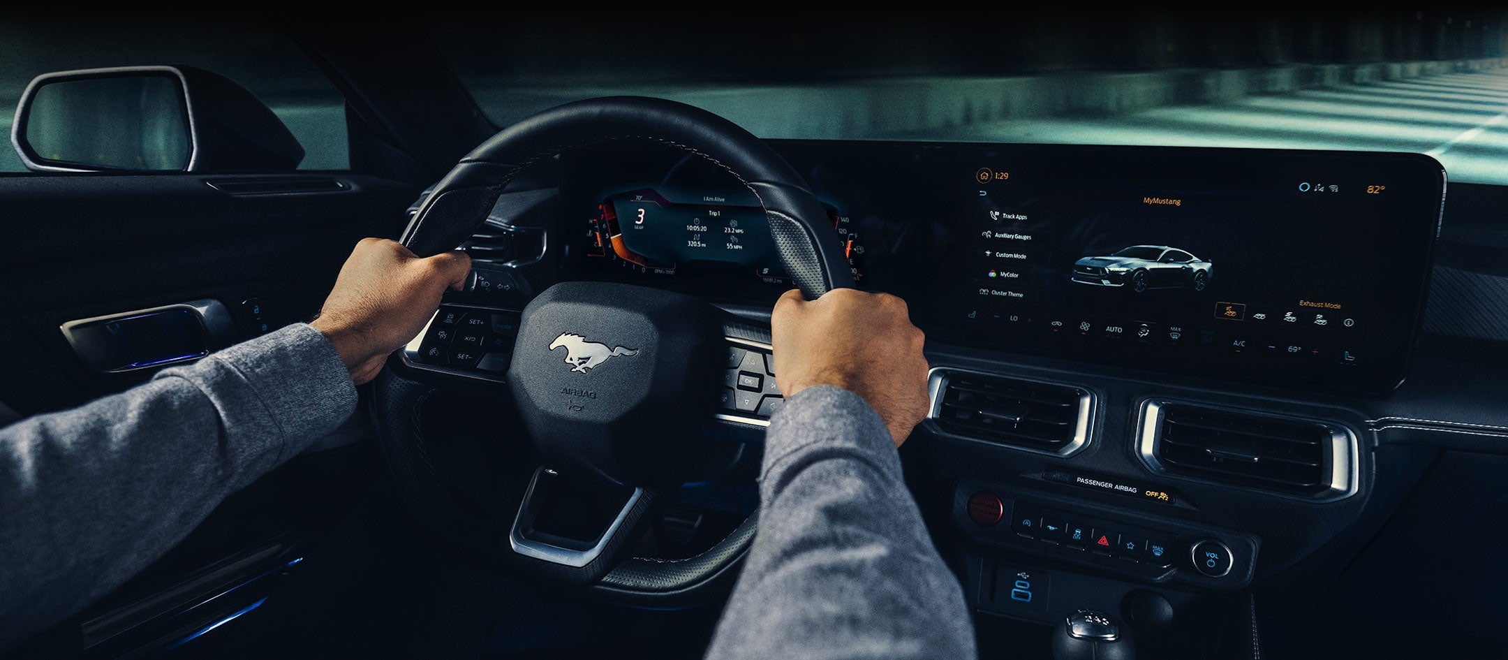 A 2024 Ford Mustang® model interior with a person driving | Bergstrom Ford of Neenah in Neenah WI