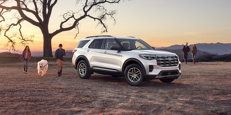 2025 Ford Explorer next to a tree
